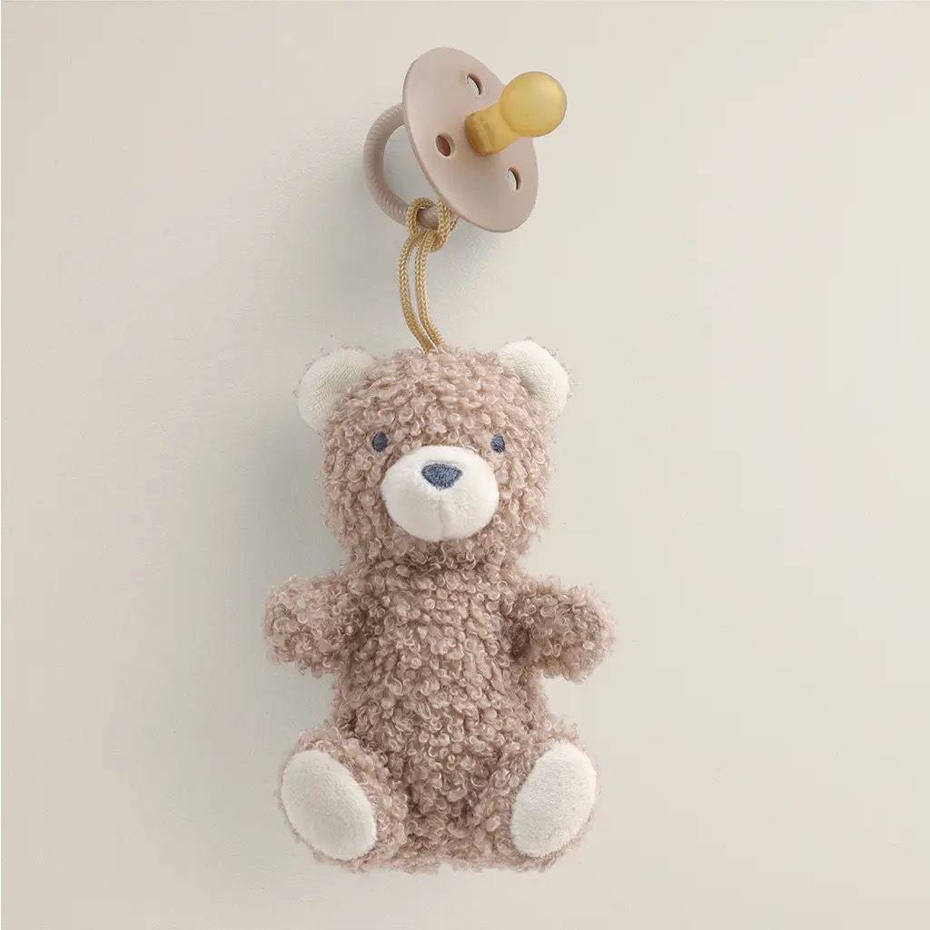 Itzy Ritzy sherpa teddy bear pacifier pal in tan with attached pacifier