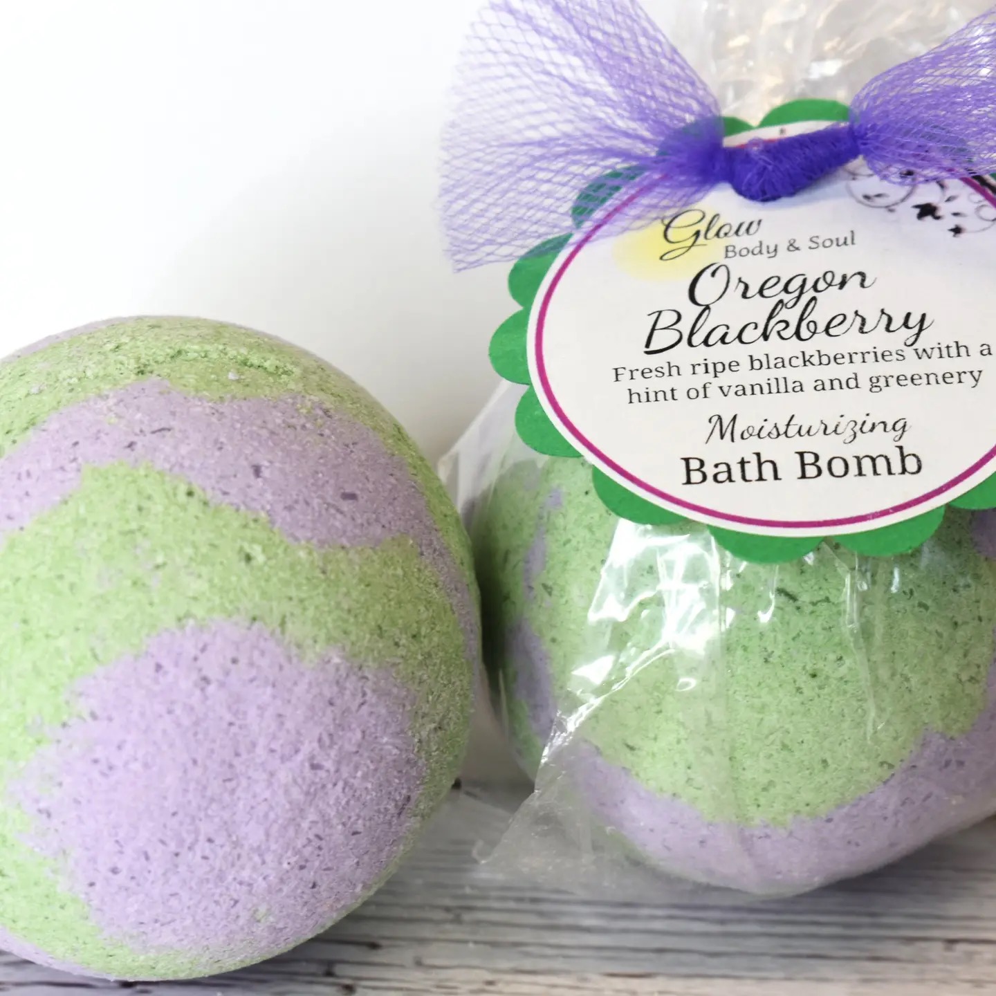 Glow Body & Soul Oregon Blackberry green and purple swirled moisturizing bath bomb with fresh blackberry vanilla scent